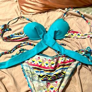 Medium teal two piece bathing suit cross tie patterned bottoms used